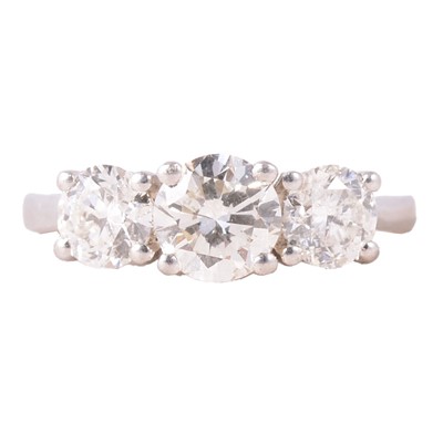 Lot 60 - A diamond three stone ring.
