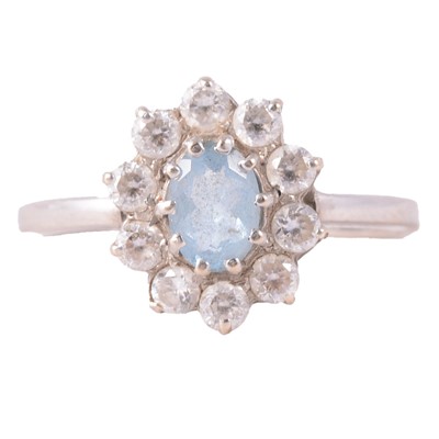 Lot 33 - A heat treated blue topaz and white stone (not diamond) ring.