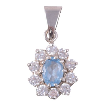 Lot 190 - A heat treated blue topaz and white stone (not diamond) pendant.
