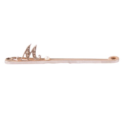Lot 139A - A diamond and seed pearl bar brooch.