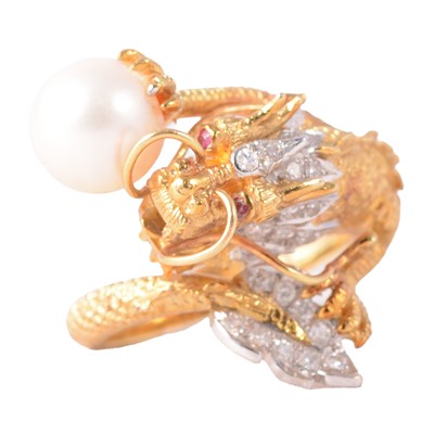Lot 90A - A dragon design diamond and pearl dress ring.