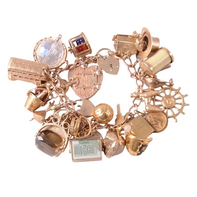 Lot 169A - A 9 carat yellow gold charm bracelet with charms.