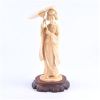 Lot 88 - A Japanese carved ivory okimono, a Geisha...