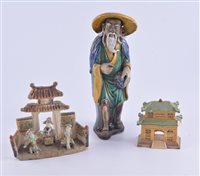 Lot 66 - Far Eastern stoneware figure of bearded man,...