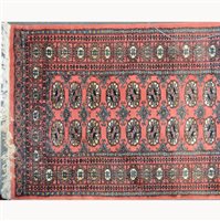 Lot 581 - Pakistan Bokhara rug, two rows of guls on a...