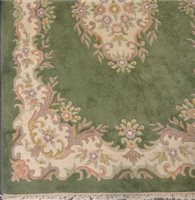 Lot 583 - Chinese green ground rug, in pale floral...