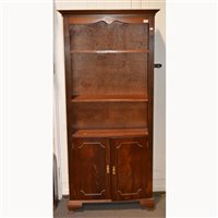 Lot 565 - Reproduction mahogany bookcase, open top above...