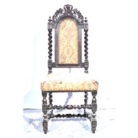Lot 549 - Oak elbow chair, carved cresting above slats,...