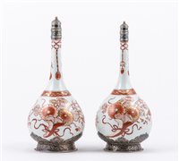 Lot 10 - Near pair of Imari porcelain bottles, probably...