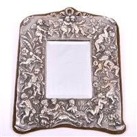 Lot 96 - A white metal faced mirror, the frame with...