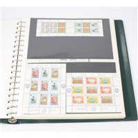 Lot 221 - A collection of stamps - two albums Isle of...