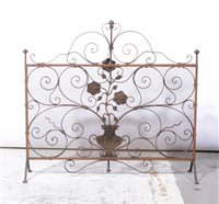 Lot 414 - Wrought iron and mesh fire guard, width 75cm.