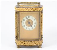 Lot 119 - French brass carriage clock, the case with serpentine outlines.