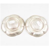 Lot 66 - Pair of Chinese silver tea saucers, Wang Chung of Hong Kong, 1880-1900.