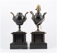 Lot 188 - A pair of black marble urns, adapted as candlesticks