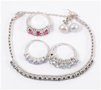 Lot 210 - A collection of silver and white metal jewellery, a tanzanite half hoop ring, a ring with aqua coloured stones