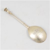 Lot 149 - Elizabeth I silver gilt seal top spoon, maker's mark a bush(?), London, 1582.