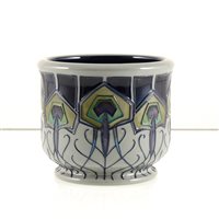 Lot 573 - A Moorcroft Pottery jardiniere , ‘Peacock Parade’ designed Nicola Slaney