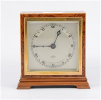 Lot 194 - An Elliott mantel clock with square dial and Roman numeral chapter ring in a square birds eye case 14cm high