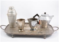 Lot 162 - A Picquot Ware five piece teaset, other brass and copper wares, handbells, money box, plated wares., cocktail shaker., egg coddlers etc