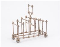 Lot 181 - An Elkington & Co silver plated toast rack, in the manner of Dr Christopher Dresser.