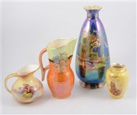 Lot 34 - A pair of Crown Devon blue lustre vases decorated with galleons, 32cm, two 13cm cream jugs decorated with fruit and signed Carter