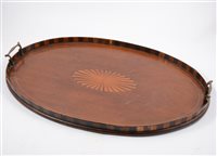 Lot 142 - A selection of four early 20th Century trays and a mirror