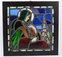 Lot 227 - A stained glass panel of the Madonna and a church steeple originally from a a demolished church in Exeter, 31cm square in a black frame overall 38cm square.