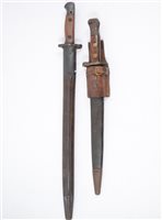 Lot 141 - wo Bayonets, one marked Wilkinson 1907 with two piece wooden grip in a steel mounted leather sheath 57cm, another later bayonet marked ER