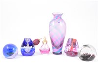 Lot 40 - Seven Caithness paperweights, to include "Aztec Spires" 17/500, "Myriad" a cranberry and turquoise coloured 23cm swirl vase