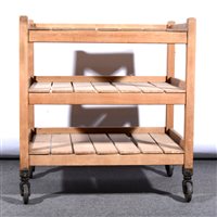 Lot 427 - A vintage wooden three tier trolley with slatted shelves