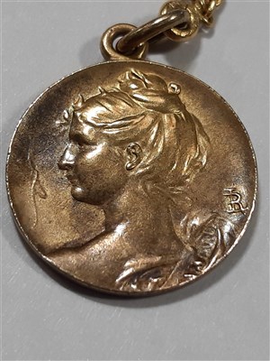 Lot 265 - A Russian yellow metal charm necklace, with two pendants and a locket by Fabergé