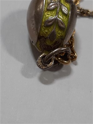 Lot 265 - A Russian yellow metal charm necklace, with two pendants and a locket by Fabergé