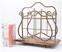 Lot 97 - An Edwardian style magazine rack, oak platform, width 39cm, and a collection of DVD's.