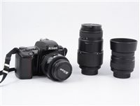 Lot 206 - Nikon F-601 SLR Camera with 4 lenses and accessories.