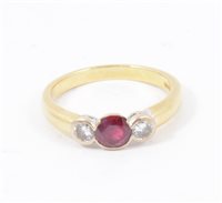 Lot 190 - A ruby and diamond three stone ring, a circular ruby and two brilliant cut diamonds collet set in an 18 carat yellow and white gold mount, hallmarked Birmingham 1996, ring size M.
