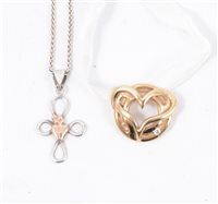 Lot 196 - A Catherine Best "Love For Life" 9 carat yellow gold pendant set with a small diamond, 0.03 carat g-h, vs, on a cream cord ribbon