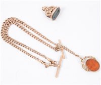 Lot 199 - A 9 carat rose gold double albert watch chain, solid graduated curb links fitted with two T bars and two swivels