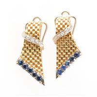 Lot 187 - A pair of 18 carat yellow and white gold earclips, the yellow gold tapered brick construction set with five sapphires