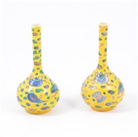 Lot 19 - Near pair of Chinese yellow ground bottle vases, 16cm