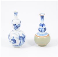 Lot 23 - Chinese blue and white double gourd-shape vase, and a Chinese blue, white and celadon bottle vase