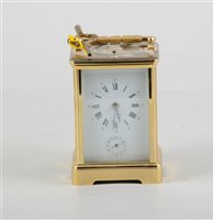Lot 150 - French brass cased carriage clock, the case with printed panels, repeating movement striking on a gong, with alarm, 15cm.