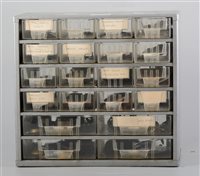 Lot 130A - Small metal cabinet of clock spares including hands, feet, mouldings, etc.