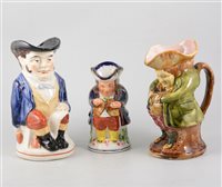 Lot 91 - Staffordshire pottery toby jug, Mr Toby standing, 23cm, other toby and character jugs and a novelty teapot.