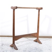 Lot 508 - An Arts and Crafts oak towel rail by Gordon Russell, circa 1925.