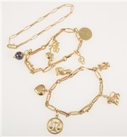 Lot 259 - Three yellow metal bracelets with angular links with ten charms attached, not marked, gross weight approximately 33.5gms.(3)