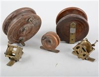 Lot 82 - Mahogany and brass vintage fishing reel, 10.5cm, and four other vintage fishing reels, (5).