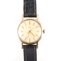 Lot 199 - Tudor - a gentleman's wrist watch, circular 26mm champagne baton dial with centre seconds hand in a yellow metal case, strap model