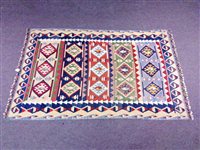 Lot 431 - A large Kilim rug