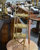 Lot 176 - A bamboo three tier cake stand with pierced gold painted trays, 96cm, a vintage parasol with horn handle and dust cover.